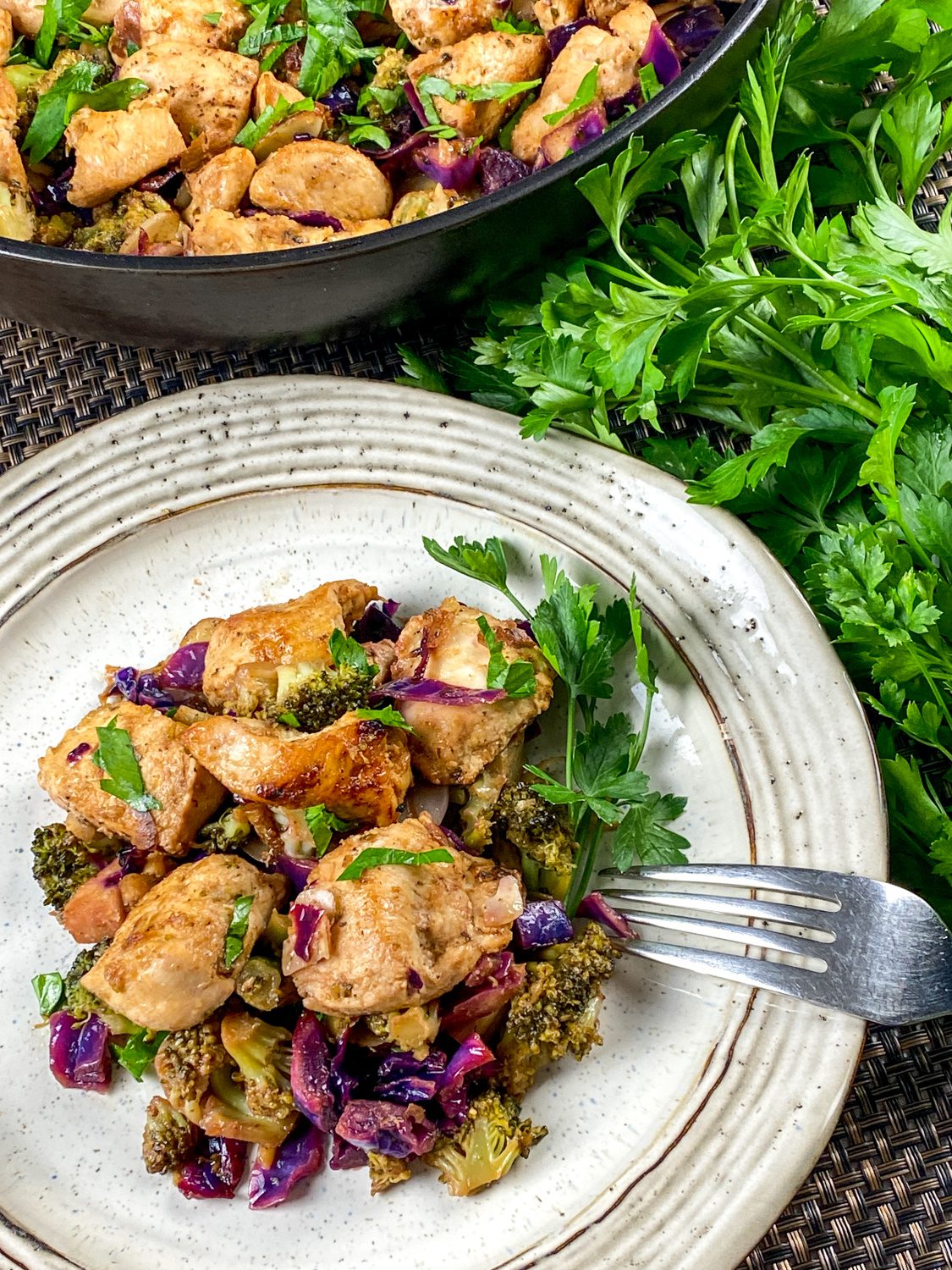 plate of chicken, broccoli, and cabbage in a lemon garlic sauce