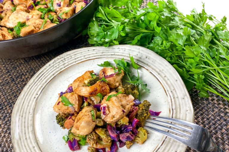 plate of chicken, broccoli, and cabbage in a lemon garlic sauce