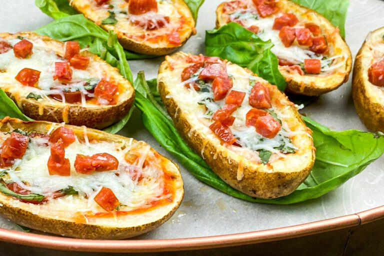 Pizza-stuffed potato skins topped with melted mozzarella, pepperoni, and fresh basil