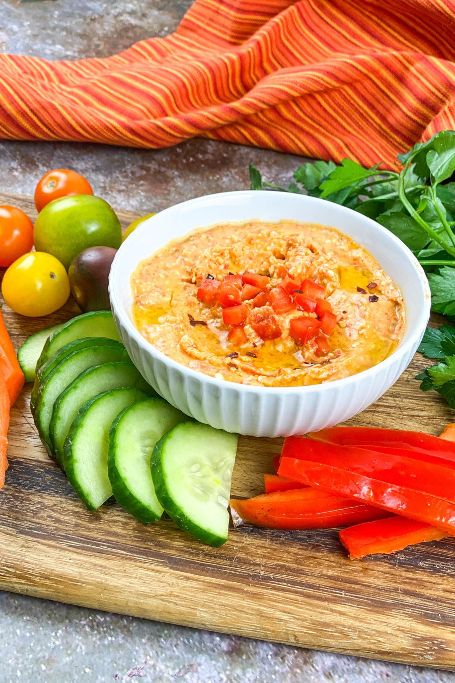 Bowl of spicy feta dip with roasted red peppers and red pepper flakes