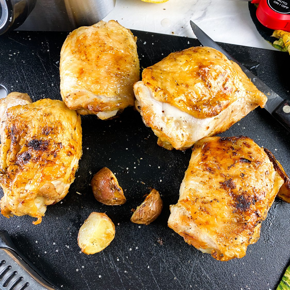 Crispy lemon rosemary chicken thighs on a serving platter