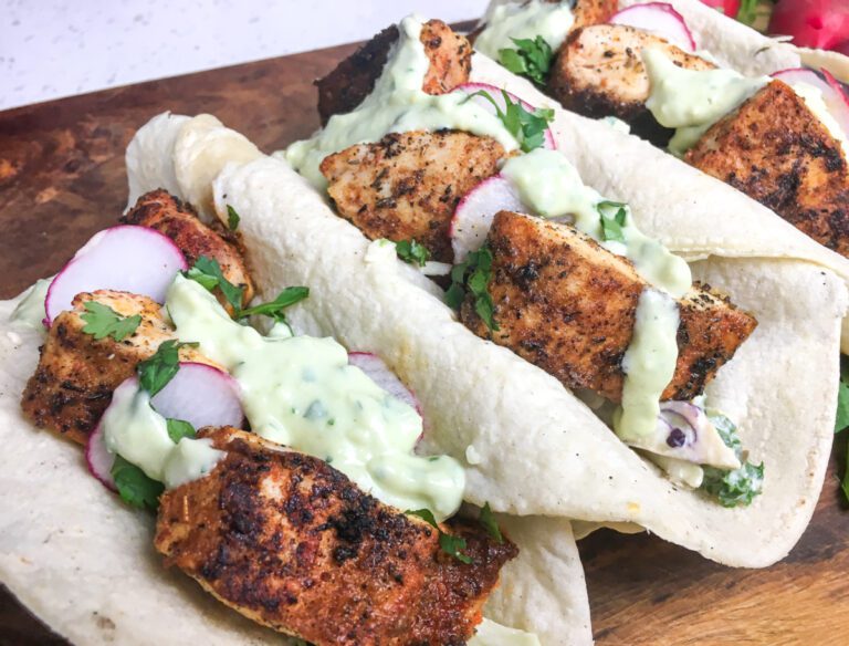 Blackened fish tacos with cabbage and creamy avocado sauce