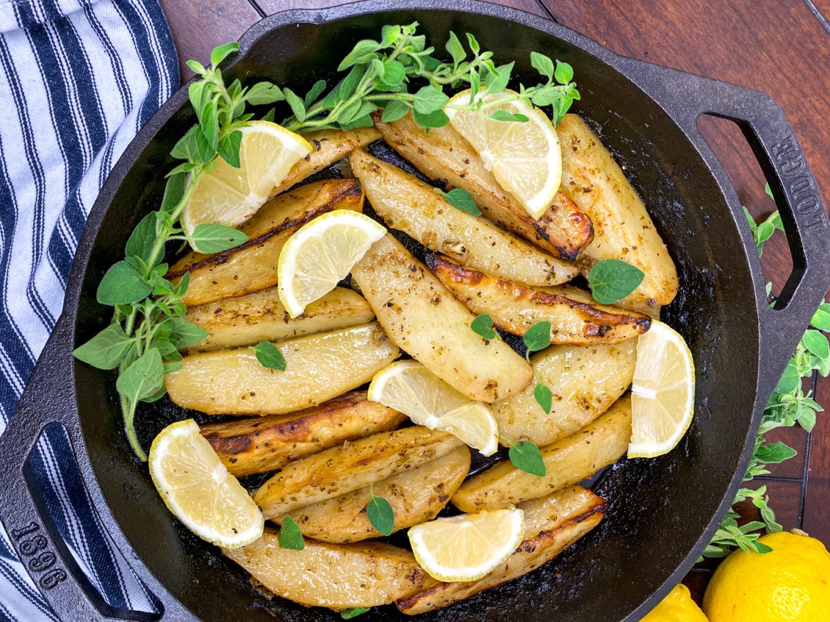 Greek-Style Lemon Potatoes (Patates Lemonates) in a cast iron pan