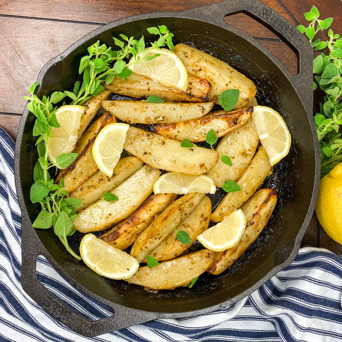 Greek-Style Lemon Potatoes (Patates Lemonates) in a cast iron pan