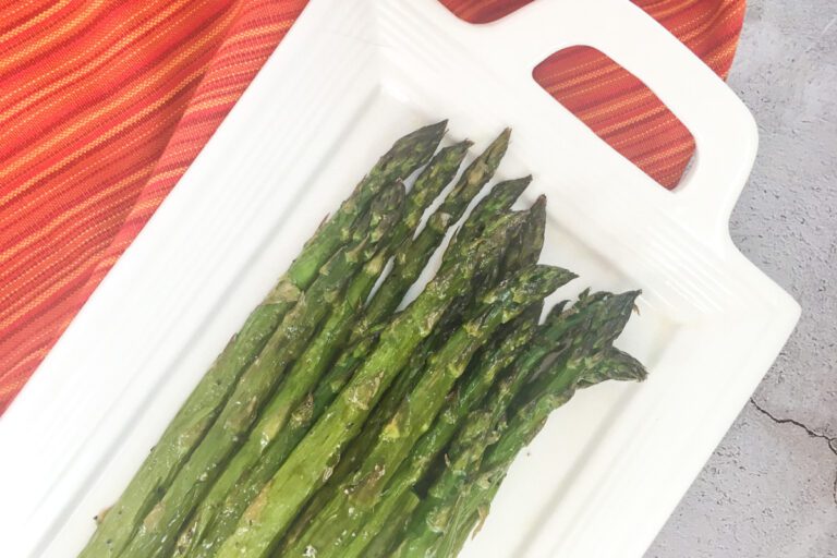 Easy oven roasted asparagus on a white platter