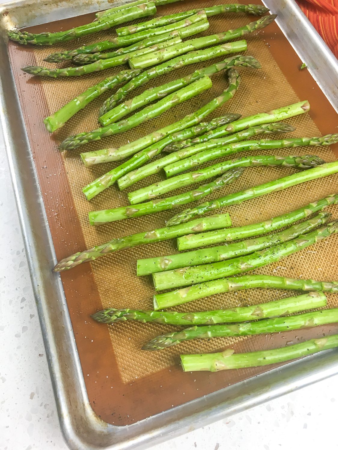 oven roasted asparagus on a baking sheet