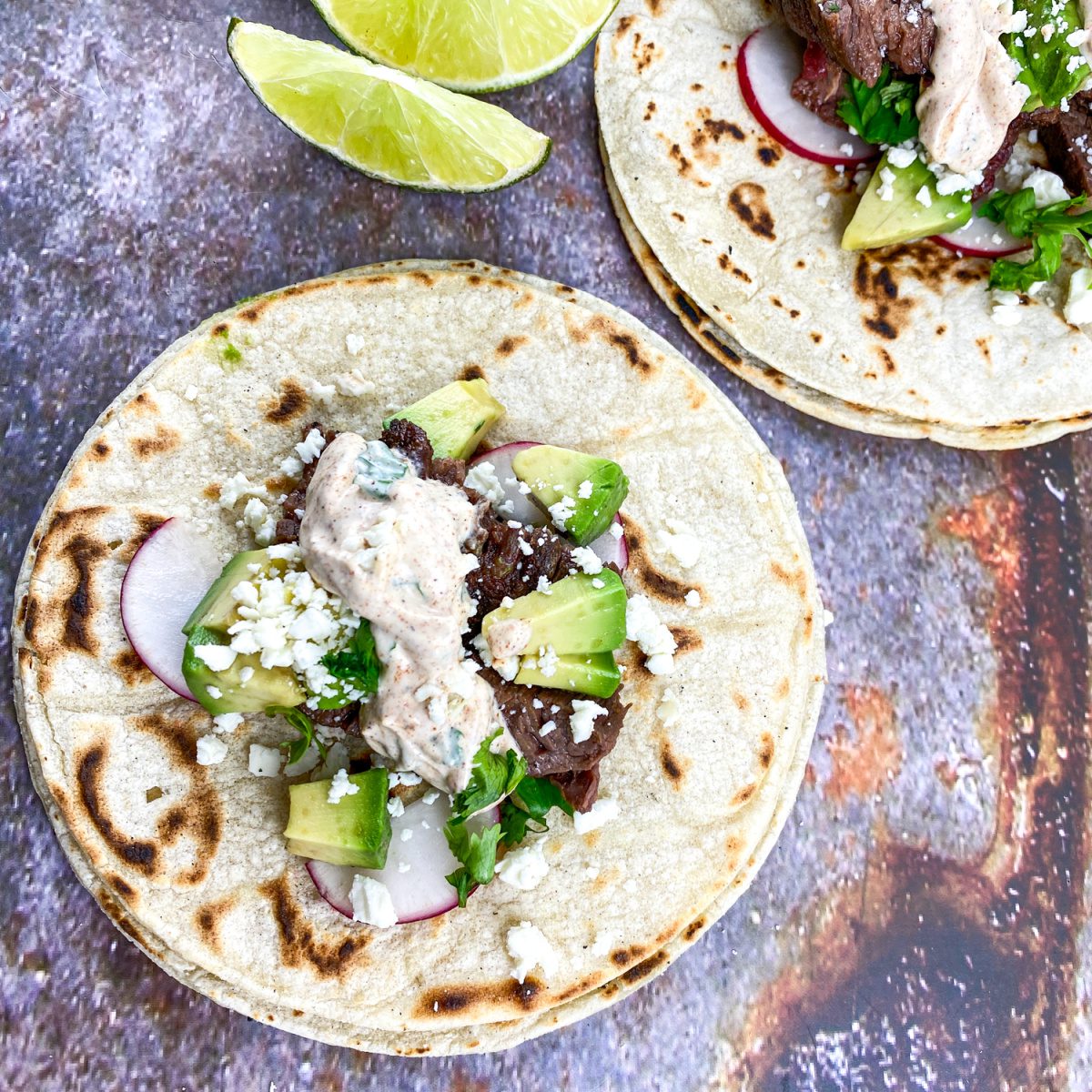 street style steak tacos with lime crema