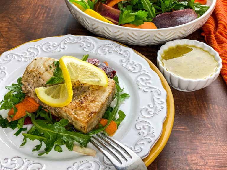 Swordfish on a bed of arugula with a carrot ribbon salad