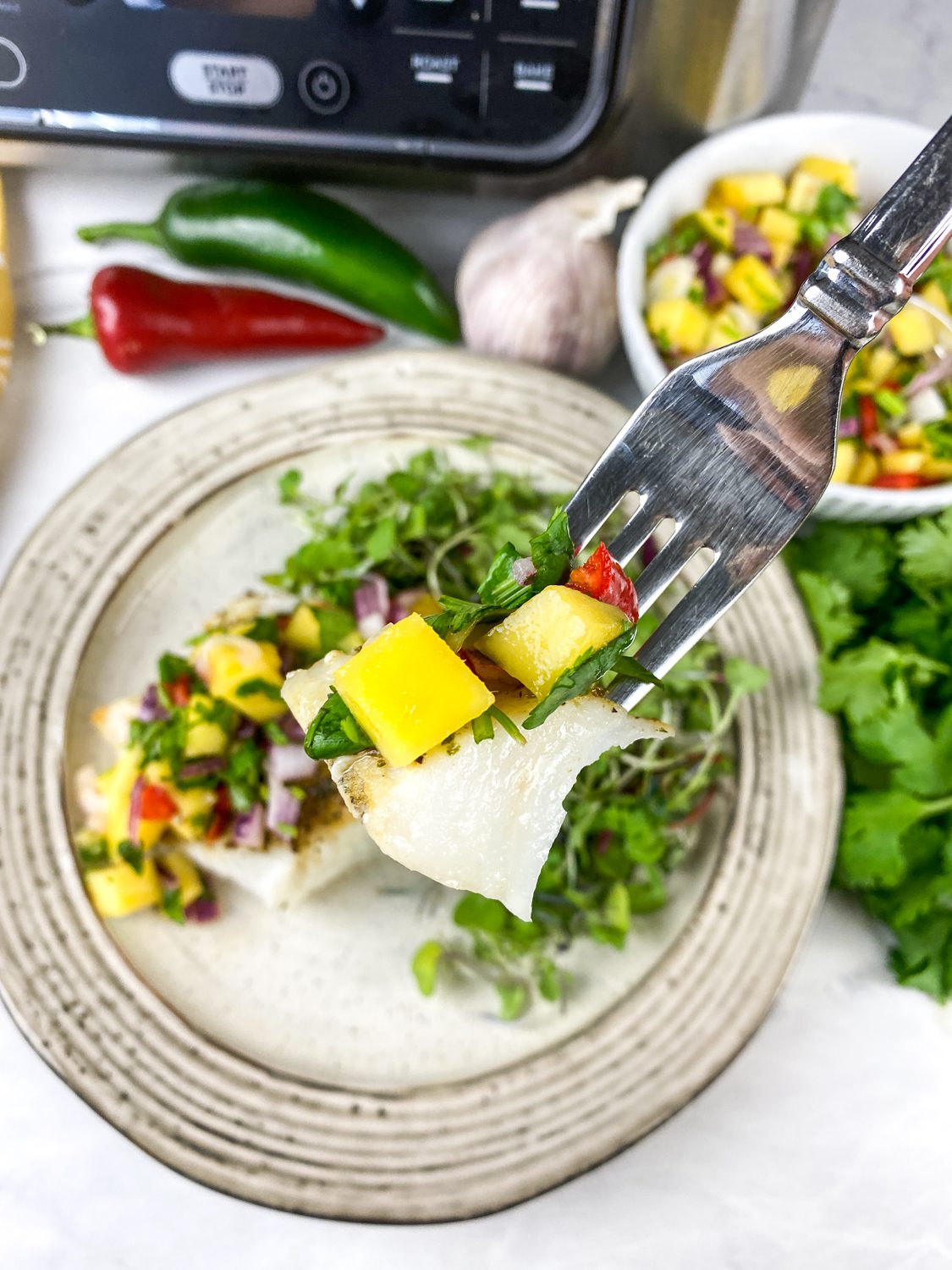 air fryer cod with spicy mango salsa
