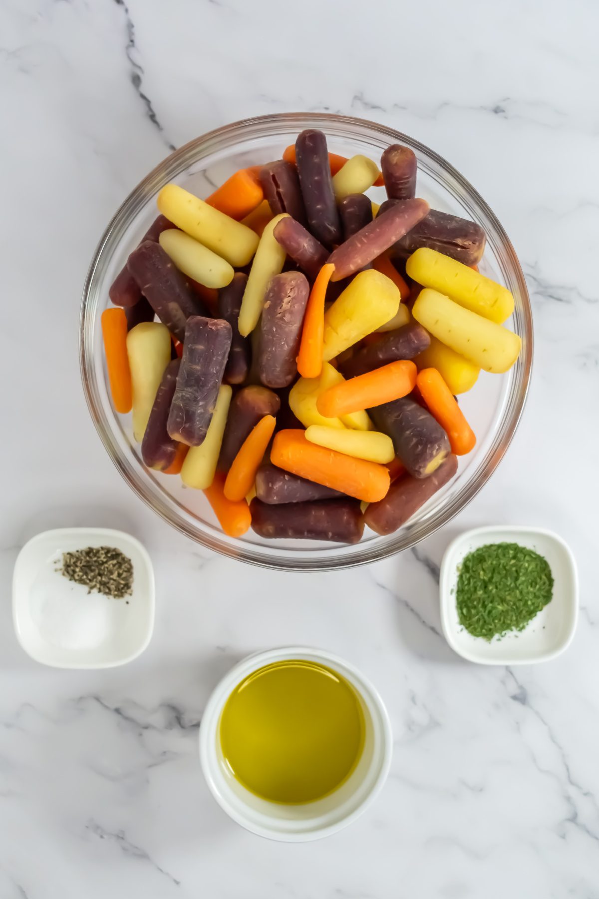 Overhead shot of colorful roasted carrots in a bowl