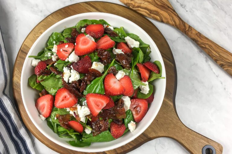 Wilted Spinach Salad with Hot Bacon Dressing, goat cheese, and strawberries