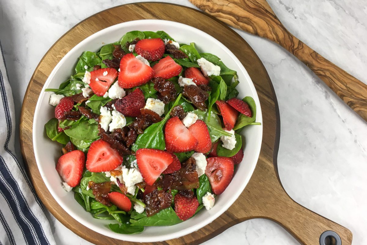 Wilted Spinach Salad with Hot Bacon Dressing, goat cheese, and strawberries